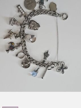 Sterling Silver Multi-Charm Bracelet with Light Blue Drop